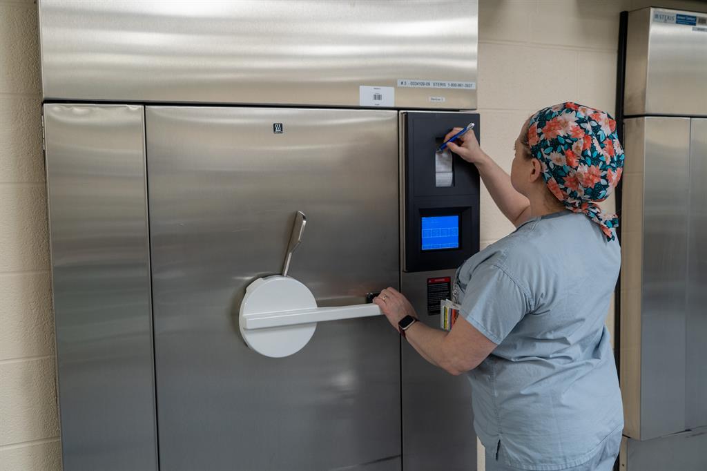 Jenn checking the steam sterilizer print out